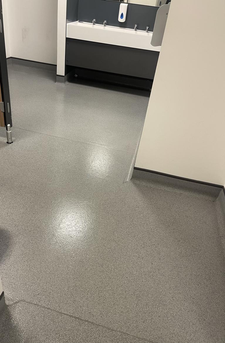 The same commercial washroom after professional cleaning by Cadence Clean