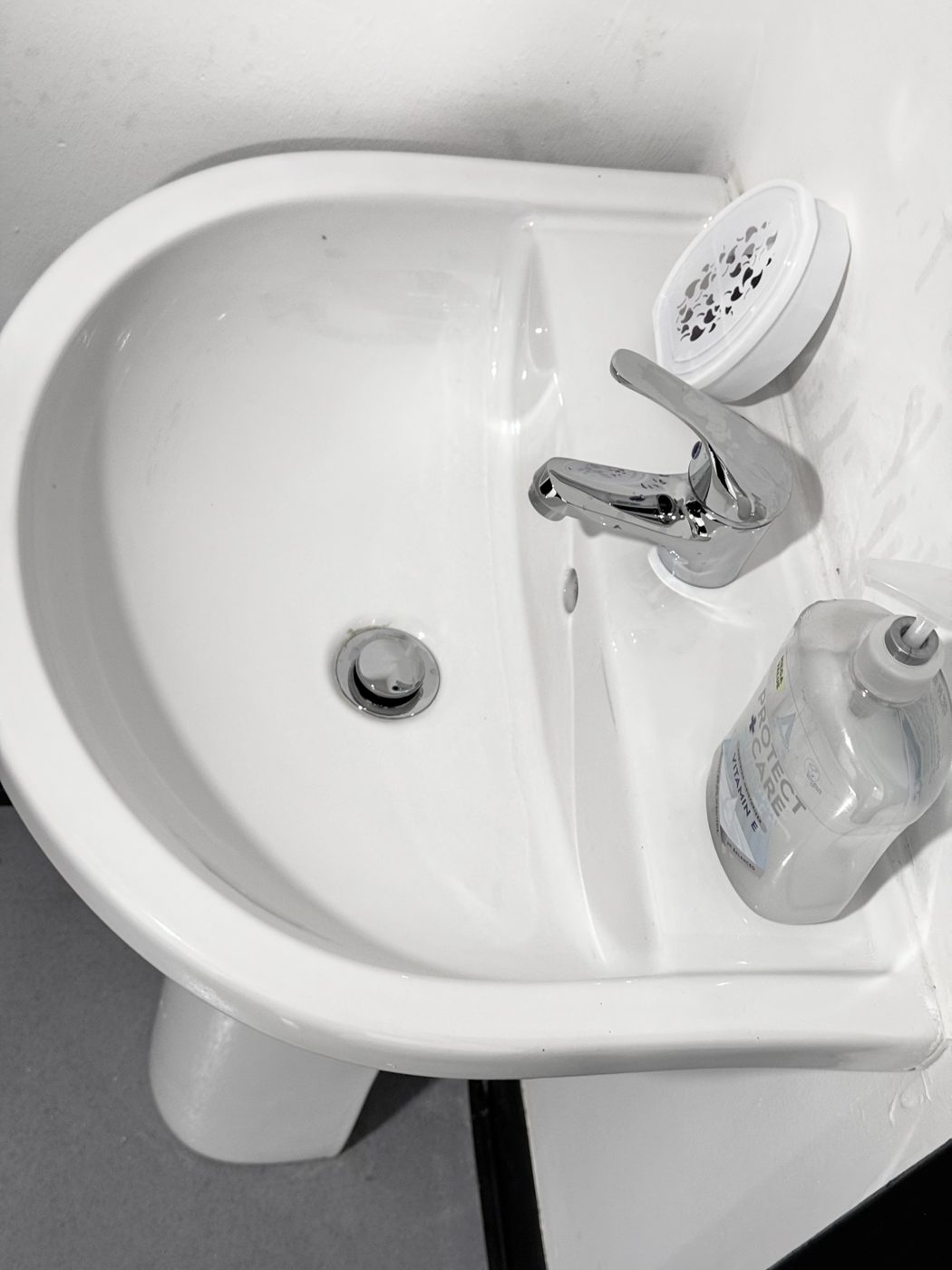 A polished hand basin and chrome tap at an office cleaned by Cadence Clean